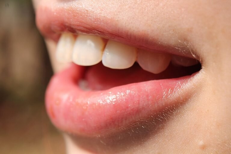 Are there objective measures of facial symmetry used in smile analysis?