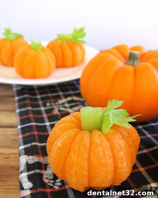 Peeled clementine oranges with a small piece of celery in the top to look like pumpkins.