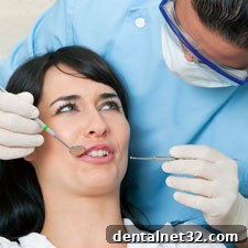 A calm patient discussing dental anxiety with her dentist
