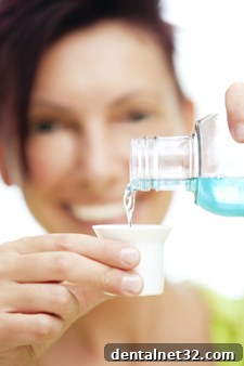 Dentist applying a professional fluoride varnish to a patient's teeth to prevent cavities