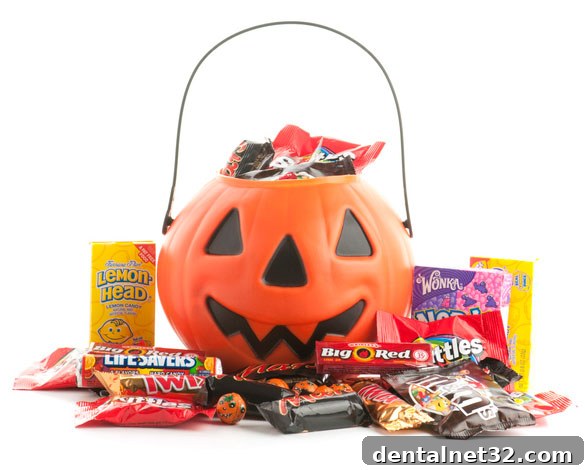 A large pile of assorted colorful Halloween candy on a table