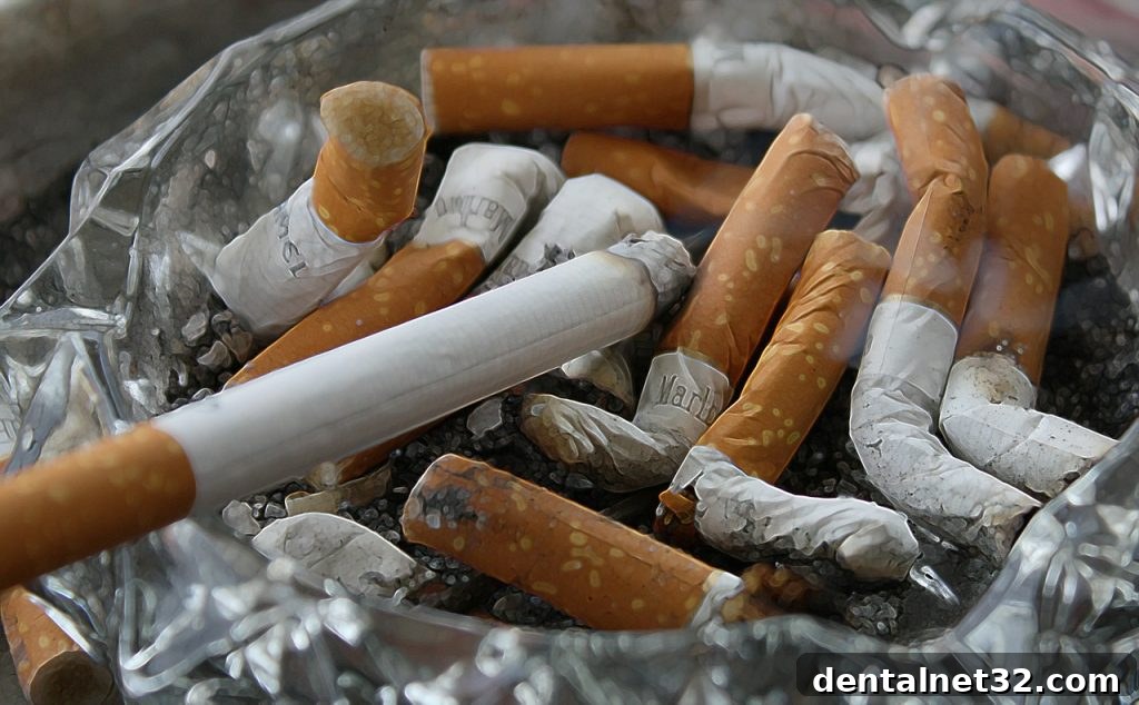 A dentist explaining the oral health risks of smoking to a patient
