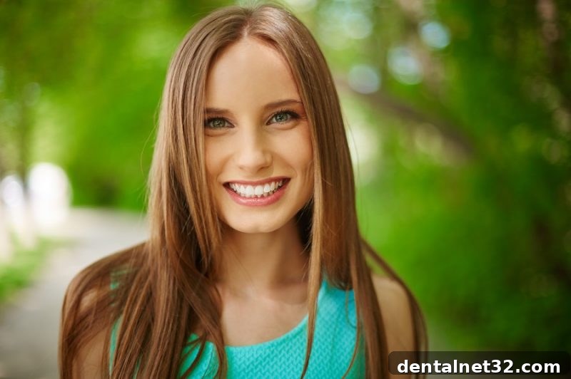Dentist showing a patient an Invisalign clear aligner model in a dental office