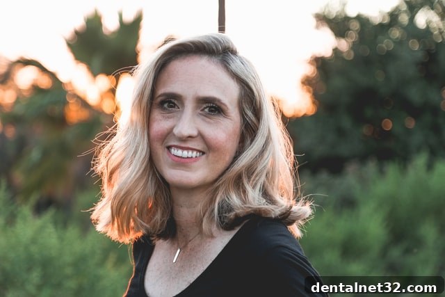 Dentist explaining the benefits of a water flosser for improved oral hygiene