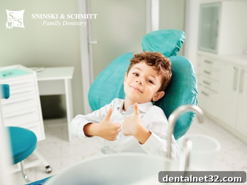 The Whole Body Impact of a Childs Cavity 2 A pediatric dentist showing a child how to brush a model of teeth